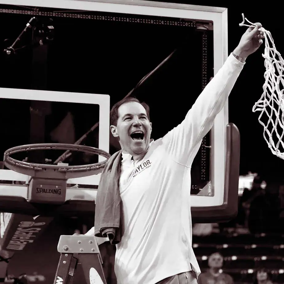 A man holding a basketball net